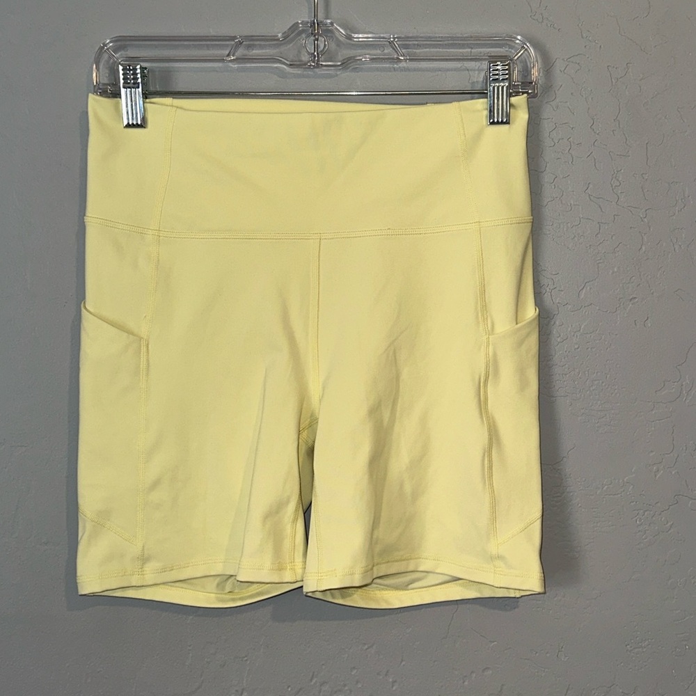 Fabletics Pale Yellow Bike Shorts with Side Pockets